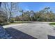 A quiet street with trees and foliage on a bright day at 2100 Mcmullen Rd, Largo, FL 33771