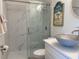 Modern bathroom featuring a stylish vanity, unique sink, and glass-enclosed shower at 250 Rosery Nw Rd # 329, Largo, FL 33770