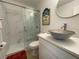 Modern bathroom featuring a stylish vanity, unique sink, and glass-enclosed shower at 250 Rosery Nw Rd # 329, Largo, FL 33770