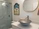Modern bathroom featuring a stylish vanity, unique sink, and glass-enclosed shower at 250 Rosery Nw Rd # 329, Largo, FL 33770