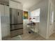 Bright kitchen area featuring stainless steel appliances and a breakfast nook with modern decor at 250 Rosery Nw Rd # 329, Largo, FL 33770
