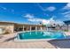 Community pool with inviting lounge area and well-maintained deck at 250 Rosery Nw Rd # 329, Largo, FL 33770