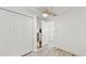 Clean bedroom with a closet, ceiling fan and bright natural light at 2504 Bayshore Dr, Belleair Beach, FL 33786