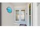 Inviting entryway featuring decorative glass doors, nautical themed decor, and a welcoming atmosphere at 2504 Bayshore Dr, Belleair Beach, FL 33786