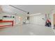 Spacious garage featuring laundry, work table, and ample storage and parking space at 2504 Bayshore Dr, Belleair Beach, FL 33786
