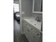 Bathroom with modern vanity, neutral walls, and view to bedroom at 2630 Pearce Dr # 103, Clearwater, FL 33764