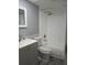Modern bathroom featuring a shower-tub combo, gray vanity with sink, and neutral decor at 2630 Pearce Dr # 103, Clearwater, FL 33764