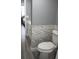 Bathroom features tile backsplash, wood-look floor, and neutral paint at 2630 Pearce Dr # 103, Clearwater, FL 33764