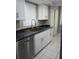 Updated kitchen featuring a stainless steel sink, modern faucet, and ample counter space at 2630 Pearce Dr # 103, Clearwater, FL 33764