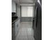Spacious kitchen with white cabinets, stainless steel appliances, and tile flooring at 2630 Pearce Dr # 103, Clearwater, FL 33764
