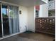 Private outdoor patio space with brick detailing and sliding glass door access at 2630 Pearce Dr # 103, Clearwater, FL 33764