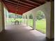 Covered patio with seating area and views to grounds at 2630 Pearce Dr # 103, Clearwater, FL 33764