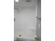 Bright shower features white tile, shower head, and gray accent walls at 2630 Pearce Dr # 103, Clearwater, FL 33764