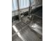 Close up of a stainless steel sink with a modern faucet, providing functionality and style at 2630 Pearce Dr # 103, Clearwater, FL 33764