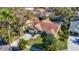 Home aerial view featuring a well-manicured lawn and a two-car garage at 2725 Onizuka Ct, Palm Harbor, FL 34683