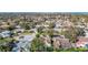Aerial view of a residential neighborhood near a large lake at 2725 Onizuka Ct, Palm Harbor, FL 34683