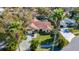 Aerial view of a home with mature landscaping and a charming facade at 2725 Onizuka Ct, Palm Harbor, FL 34683