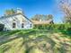 Lush backyard with healthy lawn and tall hedge for privacy at 2725 Onizuka Ct, Palm Harbor, FL 34683