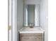 Bathroom featuring grey vanity with white countertop, rectangular mirror, and silver faucet at 2725 Onizuka Ct, Palm Harbor, FL 34683