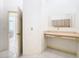 Bathroom featuring a vanity with cabinets and mirror, adjoining an open doorway at 2725 Onizuka Ct, Palm Harbor, FL 34683