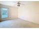 Bright bedroom featuring a ceiling fan and natural lighting at 2725 Onizuka Ct, Palm Harbor, FL 34683