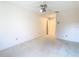 Minimalist bedroom with carpet, neutral walls, and a ceiling fan at 2725 Onizuka Ct, Palm Harbor, FL 34683