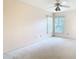 Bright bedroom featuring a ceiling fan and natural lighting at 2725 Onizuka Ct, Palm Harbor, FL 34683
