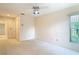 Bright bedroom featuring a ceiling fan and natural lighting at 2725 Onizuka Ct, Palm Harbor, FL 34683