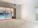 Bedroom with sliding glass door to screened pool at 2725 Onizuka Ct, Palm Harbor, FL 34683