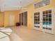 Relax on the covered patio with ceiling fan and views of the inviting pool area at 2725 Onizuka Ct, Palm Harbor, FL 34683