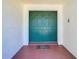 Inviting entryway featuring double doors, neutral wall color, terracotta tile flooring, and a welcome mat at 2725 Onizuka Ct, Palm Harbor, FL 34683