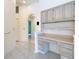 Well-lit home office space with built-in desk and cabinetry for storage at 2725 Onizuka Ct, Palm Harbor, FL 34683