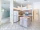 Kitchen with island and white appliances, open to living areas, great for entertaining at 2725 Onizuka Ct, Palm Harbor, FL 34683