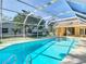Inviting swimming pool with a screened enclosure at 2725 Onizuka Ct, Palm Harbor, FL 34683