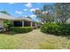 Manicured backyard with patio area at 2757 Countryside Blvd # 103, Clearwater, FL 33761