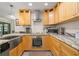 Gourmet kitchen equipped with sleek stainless steel appliances, custom cabinetry, and ample counter space at 2757 Countryside Blvd # 103, Clearwater, FL 33761