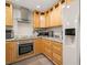 Stylish kitchen boasting modern appliances, light wood cabinetry, and ample counter space for cooking at 2757 Countryside Blvd # 103, Clearwater, FL 33761