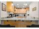 Well-equipped kitchen features ample counter space, modern appliances, and stylish design at 2757 Countryside Blvd # 103, Clearwater, FL 33761