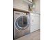 Modern washer and dryer with shelf at 2757 Countryside Blvd # 103, Clearwater, FL 33761