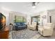 Cozy living room features contemporary decor, and floods of natural light, creating an inviting atmosphere at 2757 Countryside Blvd # 103, Clearwater, FL 33761