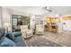 Spacious living area flows into the kitchen, highlighting the open-concept design and connectivity at 2757 Countryside Blvd # 103, Clearwater, FL 33761