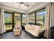 Bright sunroom with comfortable seating and large windows at 2757 Countryside Blvd # 103, Clearwater, FL 33761