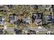 An aerial view showcases these homes with private pools and tree-lined streets in a desirable neighborhood at 3013 Ridgevale Cir, Valrico, FL 33596