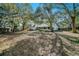 Expansive backyard with mature trees offering shade and privacy for outdoor enjoyment at 3013 Ridgevale Cir, Valrico, FL 33596