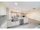 Spacious kitchen featuring granite counters, stainless steel appliances, and an open layout connected to the living area at 3013 Ridgevale Cir, Valrico, FL 33596