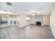 Open concept featuring fireplace, tile floors, and a smooth transition between the living area and kitchen at 3013 Ridgevale Cir, Valrico, FL 33596