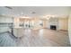Open concept featuring fireplace, tile floors, and a smooth transition between the living area and kitchen at 3013 Ridgevale Cir, Valrico, FL 33596