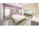 Bright bedroom with a ceiling fan, a large sliding glass door, and a calm, neutral color scheme at 3013 Ridgevale Cir, Valrico, FL 33596