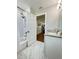 Inviting bathroom featuring white vanity, marble floors, shower with white subway tile, and modern fixtures at 3623 N 53Rd St, Tampa, FL 33619