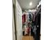 Organized walk-in closet with clothing racks and shelves for ample storage space at 3623 N 53Rd St, Tampa, FL 33619